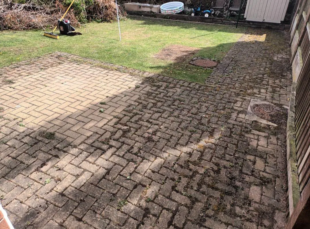 Heavily weathered paving before pressure washing